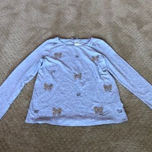 Gray long sleeve shirt with butterflies.